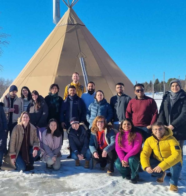 A DLNRS event pictured through participants outside a lavvo