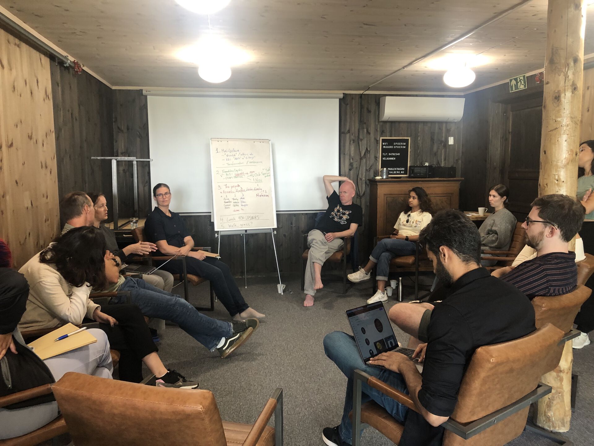 A picture of people discussing in a circle