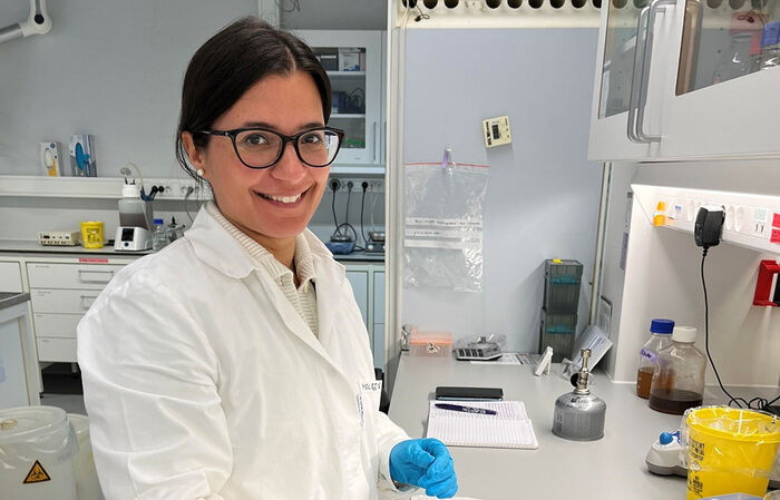 A picture of Clizia Rusotto with lab coat and gloves