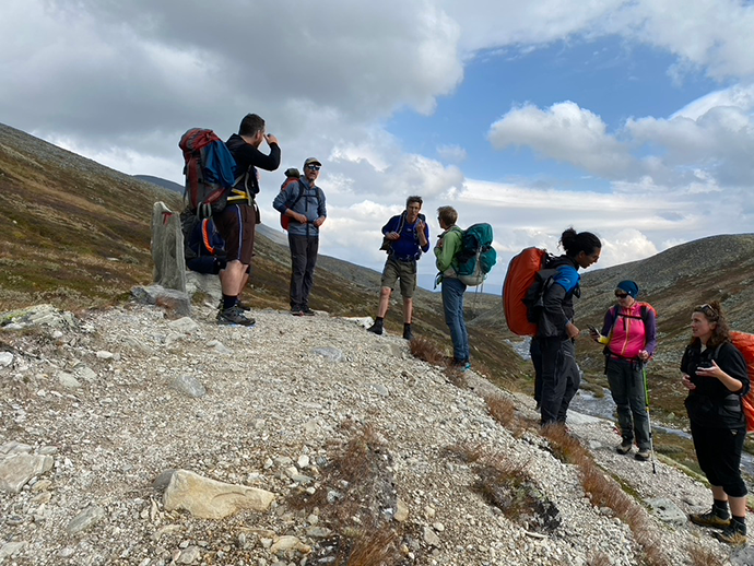 Participants talking during a break in the middle of the mountains