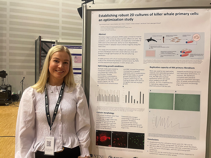 Sigrid Hoven next to her poster