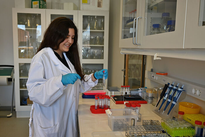 A picture of Ana Lucia preparing a sample