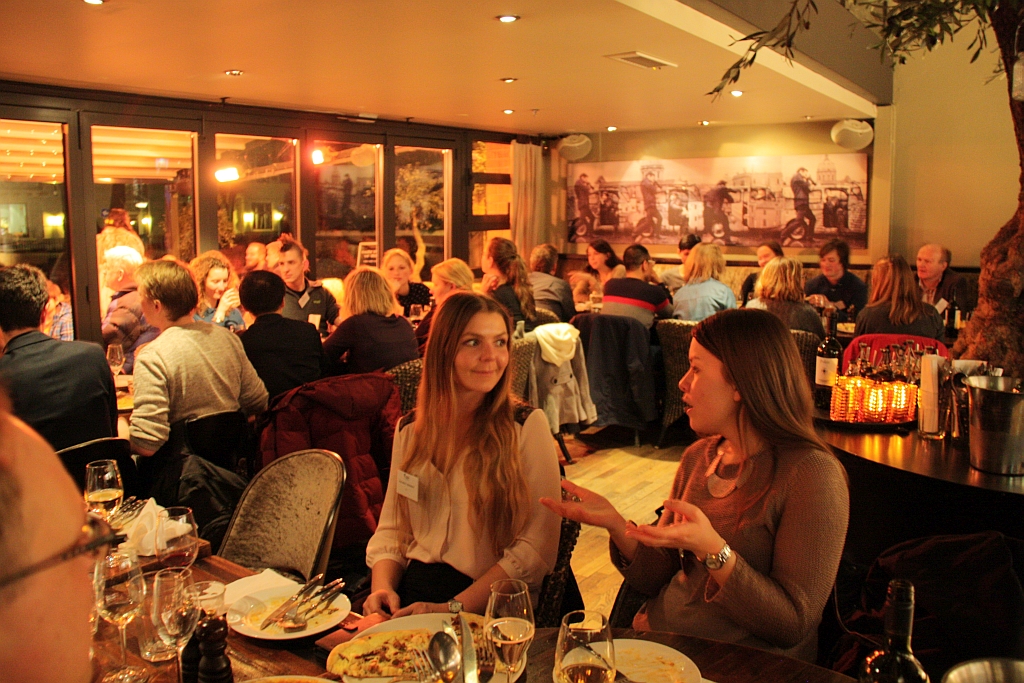 Many people dining together in a restaurant